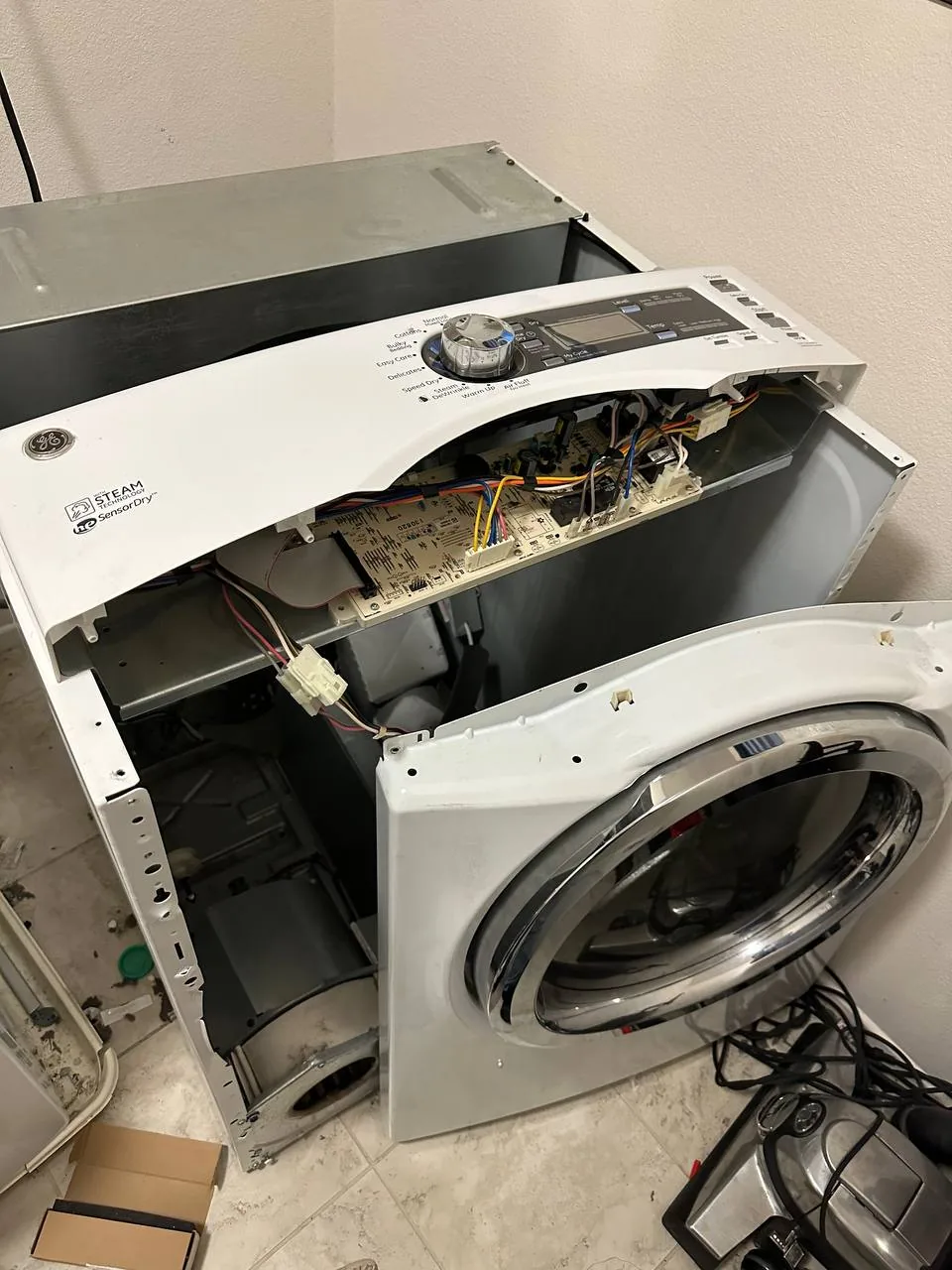 The dryer cabinet left open during the bench condition that caused the misleading short cycles.